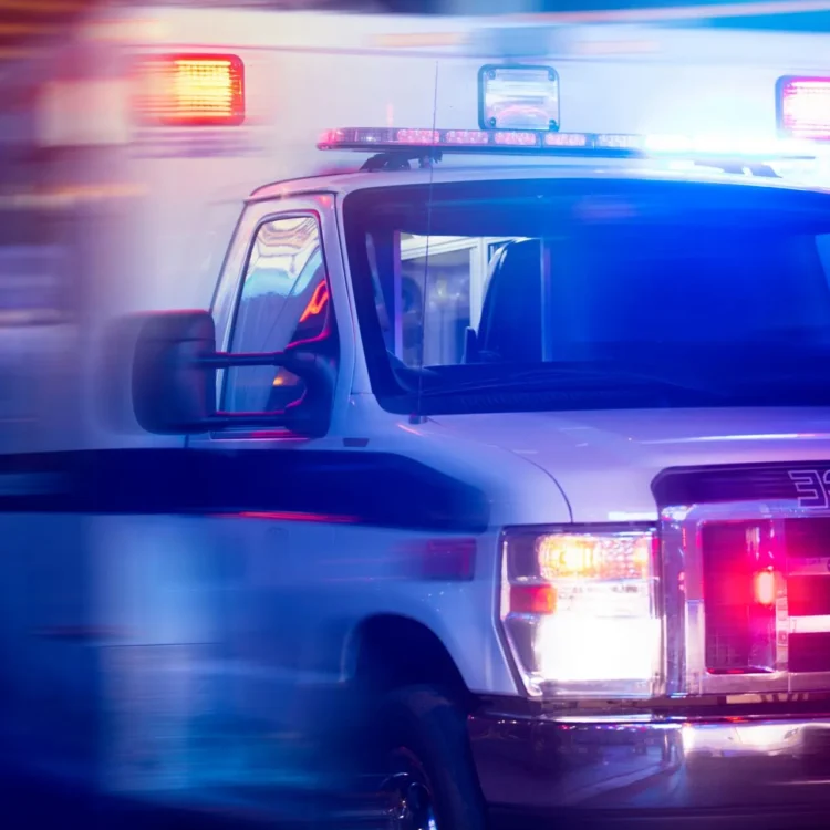 ambulance with its lights on at night